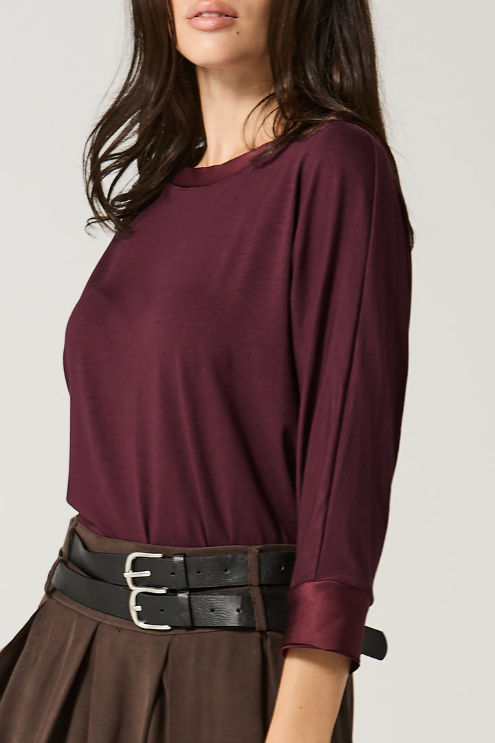 Maglia con bordi in satin