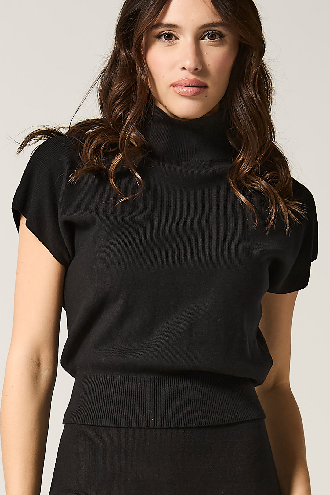 Maglia lupetto smanicata