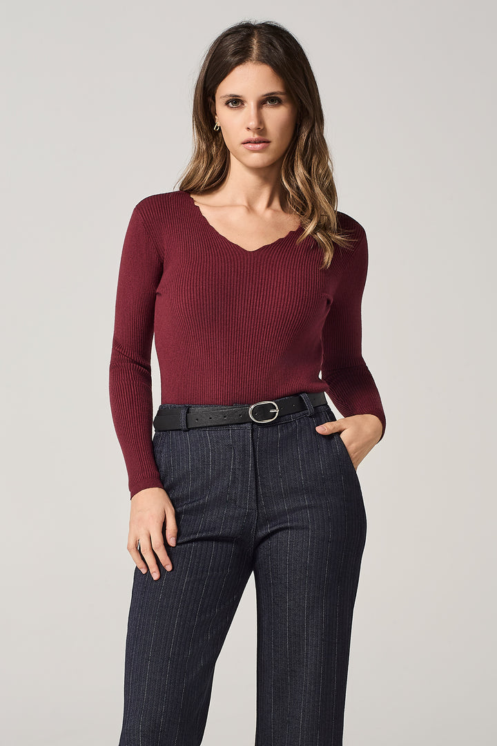 Maglia scollo a V con bordi a ondine