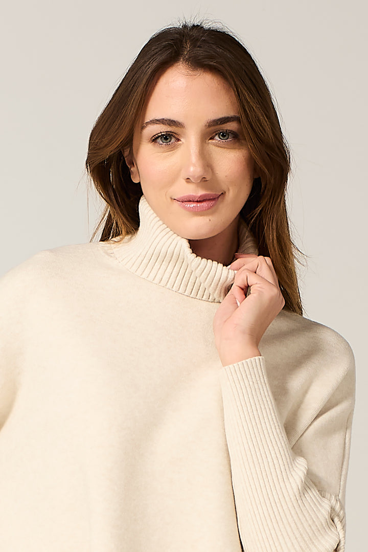 Maglia dolcevita con manica in costa