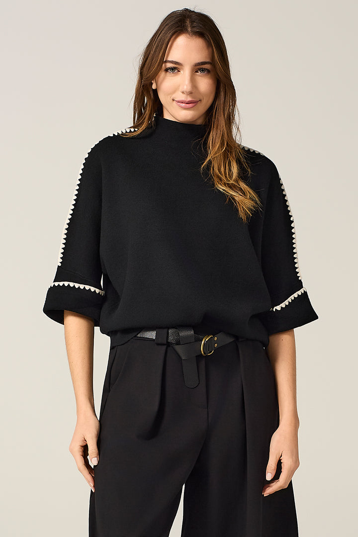 Maglia con ricami a contrasto