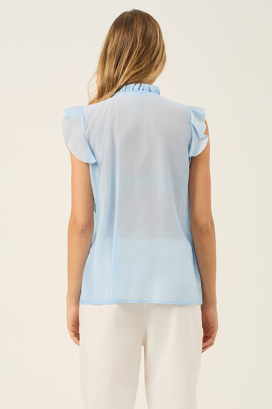 Camicia smanicata con volant